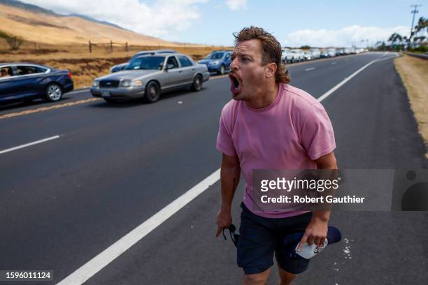Ma'aleea, Maui, Saturday, August 12, 2023 - Residents wait in long lines as they are not allowed to pass a checkpoint to return to their homes hoping...