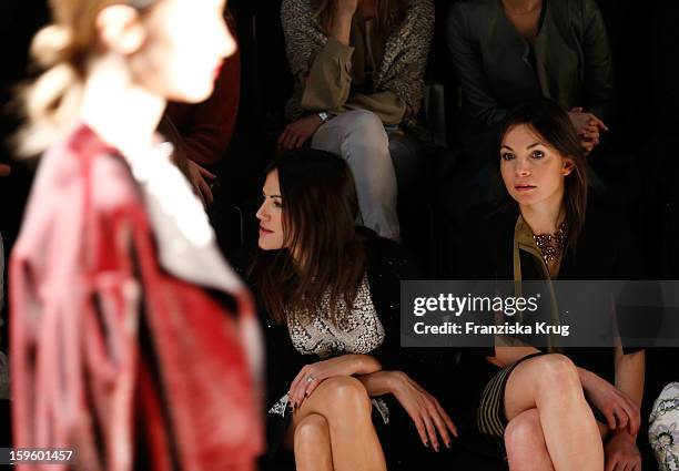 Bettina Zimmermann and Nadine Warmuth attend Schumacher Autumn/Winter 2013/14 Fashion Show during Mercedes-Benz Fashion Week Berlin at Brandenburg...