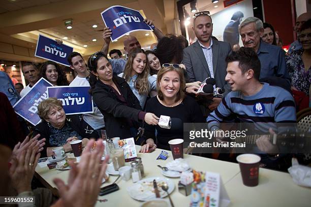 Former Israeli foreign minister Tzipi Livni, the leader of new party, The Movement, speaks to potential voters during an election event at a shopping...