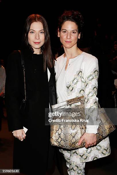 Nora von Waldstaetten and Bibiana Beglau attend Schumacher Autumn/Winter 2013/14 Fashion Show during Mercedes-Benz Fashion Week Berlin at Brandenburg...