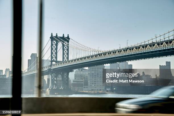 manhattan bridge from interior of a car. new york city usa - dumbo new york fotografías e imágenes de stock