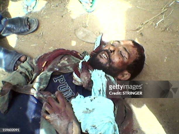 Picture taken with a mobile phone on January 12, 2013 reportedly shows the body of a fighter of Islamist insurgent group Ansar Dine allegedly killed...
