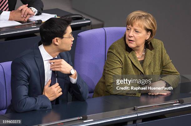 German Economy Minister and Vice Chancellor Philipp Roesler and German Chancellor Angela Merkel arrive at the Reichstag, the seat of the German...