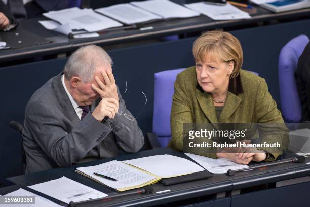 German Finance Minister Wolfgang Schaeuble and German Chancellor Angela Merkel attend the debate on the Annual Economic Report 2013 of the Federal...