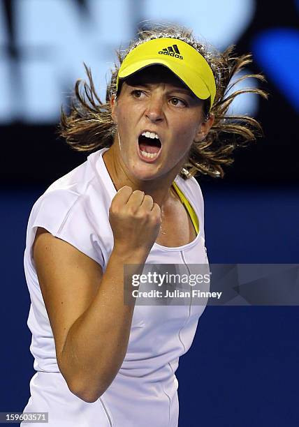 Laura Robson of Great Britain celebrates in her second round match against Petra Kvitova of Czech Republic during day four of the 2013 Australian...