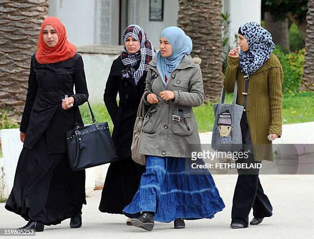 Tunisian students walk at the Manouba Faculty of Arts, Letters, and Humanities on January 17, 2013 outside Tunis. The dean of the faculty, Habib...