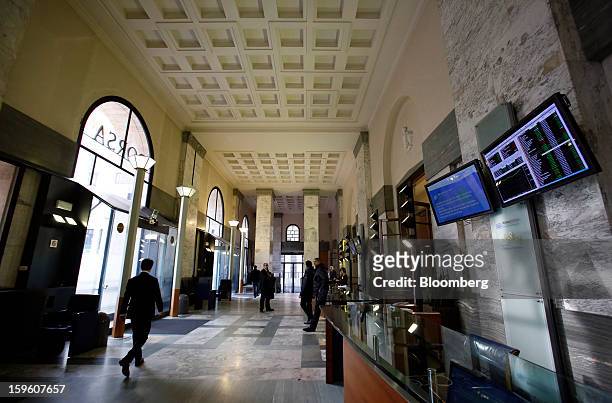 Visitor walks through the entrance hall inside the Borsa Italiana, Italy's stock exchange, which is part of the London Stock Exchange Group Plc, in...