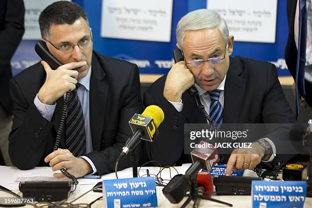 Israeli Prime Minister Benjamin Netanyahu talks to potentiel voters in an attempt to convince them to vote for his party in Tel Aviv on January 17,...