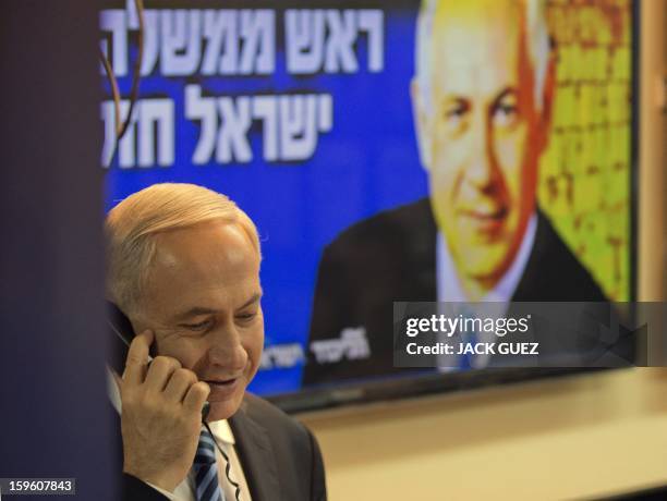 Israeli Prime Minister Benjamin Netanyahu talks to potentiel voters in an attempt to convince them to vote for his party in Tel Aviv on January 17,...