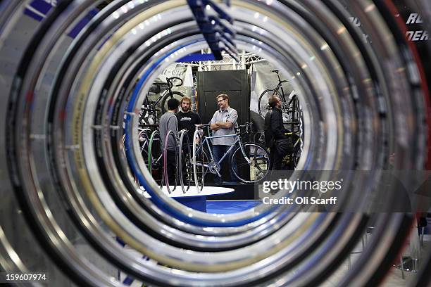 The All-City bike stand seen through a display of wheel rims at the London Bike Show which is being held in the ExCeL Centre on January 17, 2013 in...