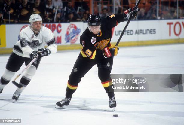 Pavel Bure of the Vancouver Canucks takes a shot during an NHL game against the Los Angeles Kings circa 1993 at the Great Western Forum in Inglewood,...