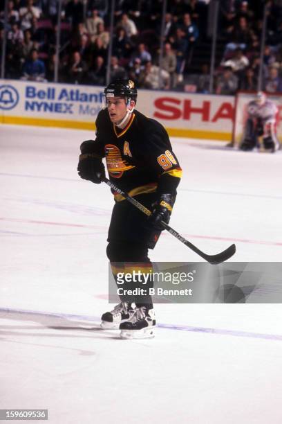 Pavel Bure of the Vancouver Canucks skates on the ice during an NHL game against the New York Rangers on November 11, 1996 at the Madison Square...