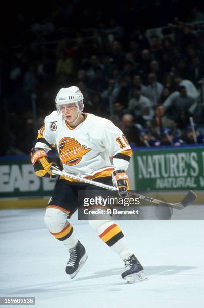 Pavel Bure of the Vancouver Canucks skates on the ice during an NHL game circa 1992 at the Pacific Coliseum in Vancouver, British Columbia, Canada.