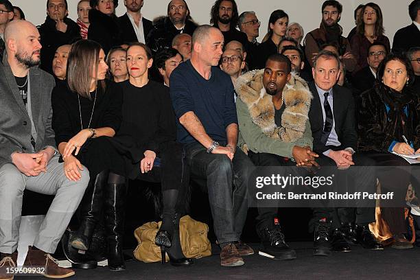 Jake Chapman, guest, Tiphaine de Lussy, Dinos Chapman, Kanye West, Michael Burke and Suzy Menkes attend the Louis Vuitton Men Autumn / Winter 2013...