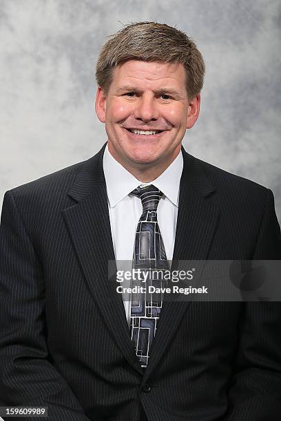 Assistant Coach Bill Peters of the Detroit Red Wings poses for his official headshot for the 2012-2013 season at Compuware Ice Arena on January 13,...