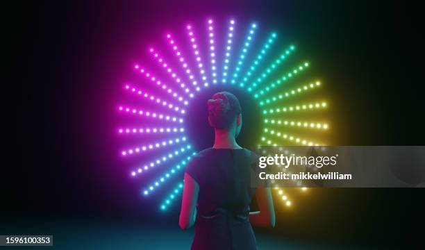 woman faces rainbow-lit portal to the unknown - different directions stock pictures, royalty-free photos & images