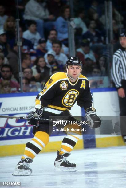 Adam Oates of the Boston Bruins skates on the ice during an NHL game against the New York Islanders on December 26, 1995 at the Nassau Coliseum in...