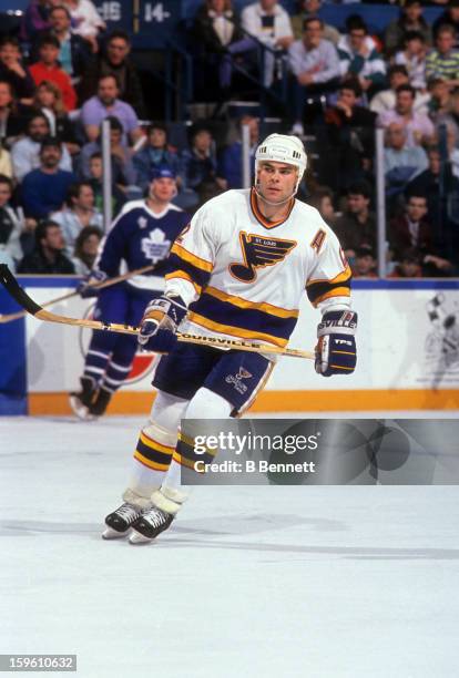 Adam Oates of the St. Louis Blues skates on the ice during an NHL game against the Toronto Maple Leafs on March 30, 1991 at the St. Louis Arena in...