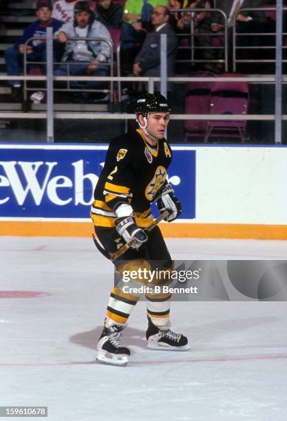 Adam Oates of the Boston Bruins skates on the ice during an NHL game against the New York Rangers on March 15, 1993 at the Madison Square Garden in...