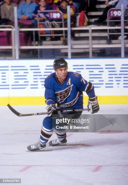 Adam Oates of the Washington Capitals skates on the ice during an NHL game against the New York Rangers on December 2, 1997 at the Madison Square...