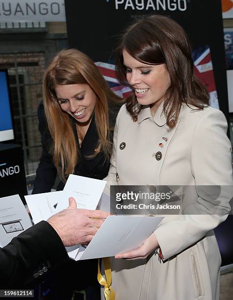 Princess Beatrice of York and Princess Eugenie of York laugh as they visit e-commerce company 'Zalando' on January 17, 2013 in Berlin, Germany. The...