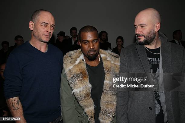 Dino Chapman, Kanye West and Jake Chapman attend the Louis Vuitton Men Autumn / Winter 2013 show as part of Paris Fashion Week on January 17, 2013 in...