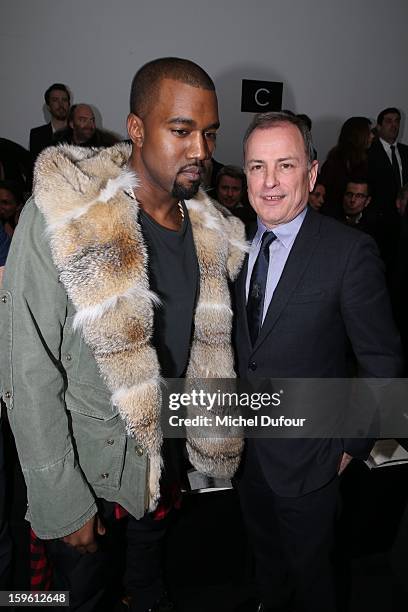 Kanye West and Michael Burke attend the Louis Vuitton Men Autumn / Winter 2013 show as part of Paris Fashion Week on January 17, 2013 in Paris,...