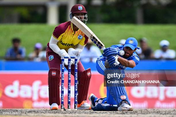 Tilak Varma, of India misses a shot during the fifth and final T20I match between West Indies and India at the Central Broward Regional Park in...