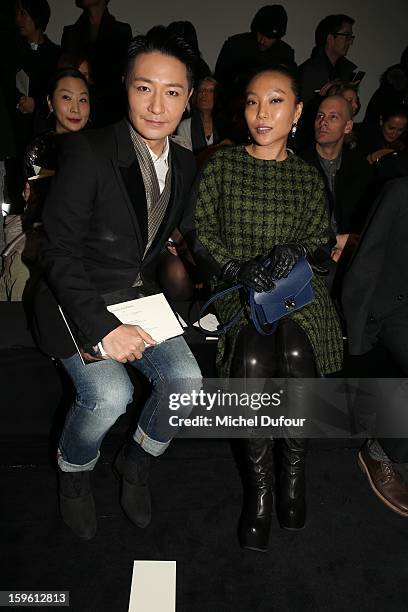 Li Zonghan and Wan BaoBao attend the Louis Vuitton Men Autumn / Winter 2013 show as part of Paris Fashion Week on January 17, 2013 in Paris, France.