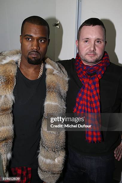 Kanye West and designer Kim Jones attend the Louis Vuitton Men Autumn / Winter 2013 show as part of Paris Fashion Week on January 17, 2013 in Paris,...