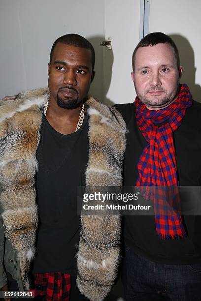 Kanye West and designer Kim Jones attend the Louis Vuitton Men Autumn / Winter 2013 show as part of Paris Fashion Week on January 17, 2013 in Paris,...