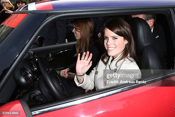 Princess Beatrice and Princess Eugenie drive a Mini in front of Brandenburg Gate as she promotes the GREAT initiative on January 17, 2013 in Berlin,...