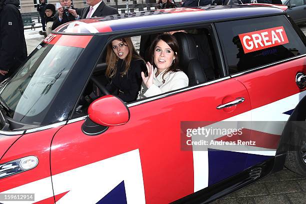 Princess Beatrice and Princess Eugenie drive a Mini in front of Brandenburg Gate as she promotes the GREAT initiative on January 17, 2013 in Berlin,...