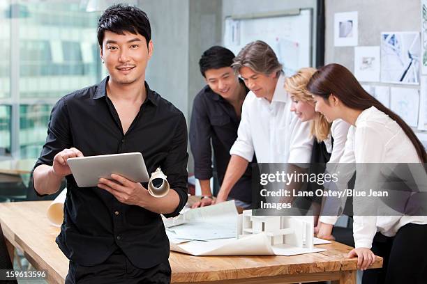 architect using digital tablet in studio - design studio woman chinese laptop fotografías e imágenes de stock