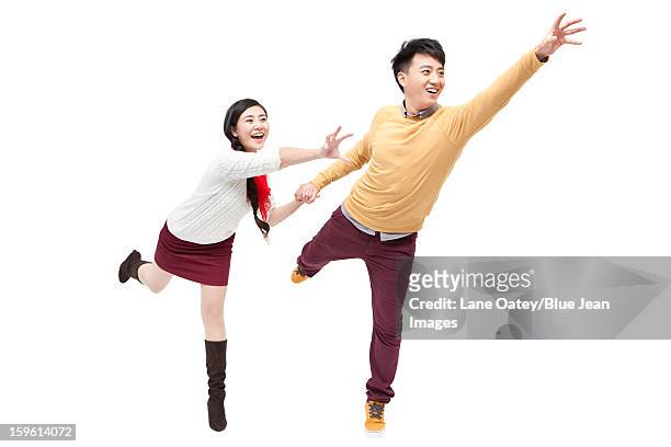 excited young couple in chinese new year - catch 22 foto e immagini stock