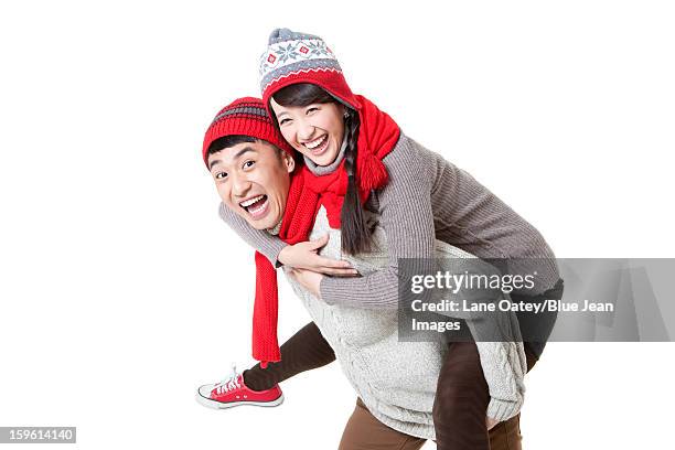 funny young couple doing piggyback in chinese new year - mad about heritage festival stockfoto's en -beelden