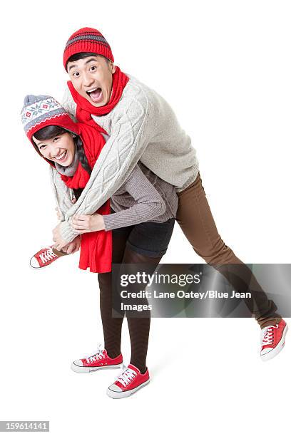 young couple doing piggyback in chinese new year - mad about heritage festival stockfoto's en -beelden