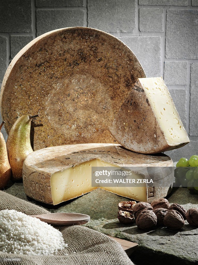 Cheese, fruit and grains on table