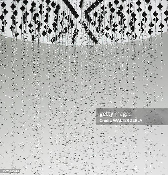 water drops falling from shower head - shower head stock pictures, royalty-free photos & images