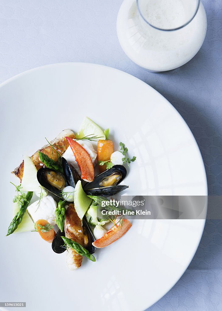 Plate of mussels with salad