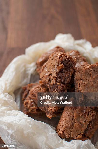 chocolate brownies in wax paper - stourbridge stock pictures, royalty-free photos & images