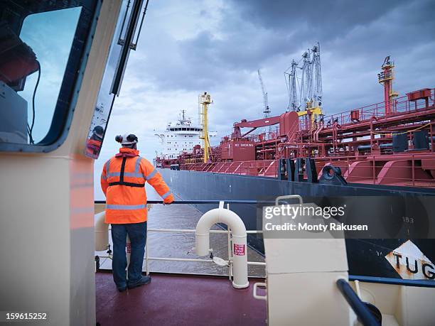 view of tanker as seen from tug - oil tanker ships stock pictures, royalty-free photos & images