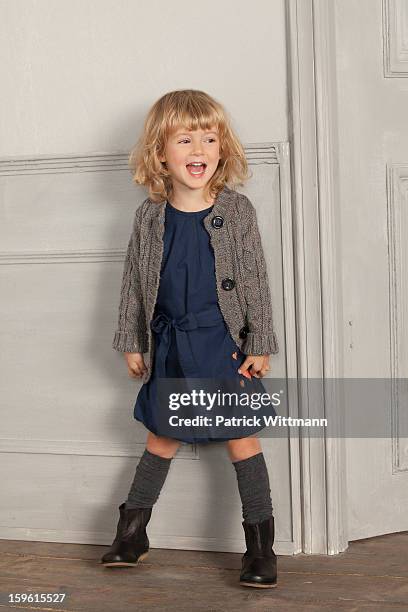 smiling girl shouting indoors - patrick wall stock pictures, royalty-free photos & images