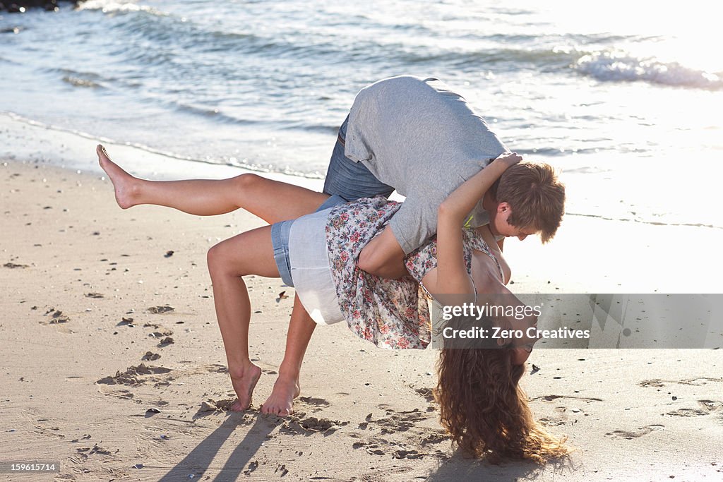Couple playing together on beach