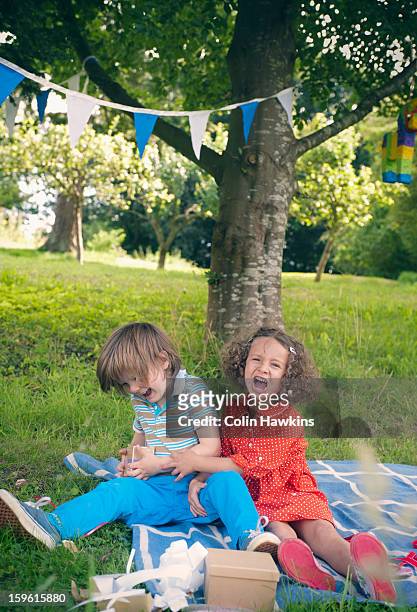 children yelling at birthday picnic - egoismus stock-fotos und bilder
