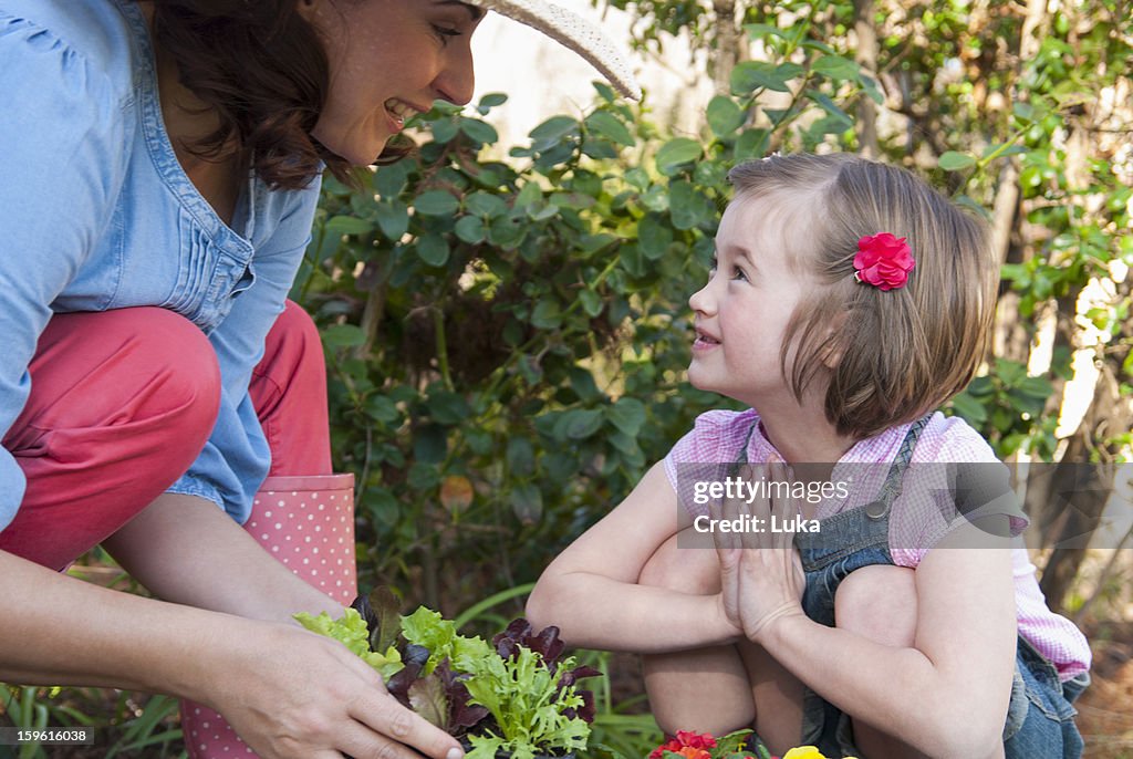 Mother and daughter gardening together