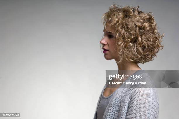 profile of womans face - curly hair profile stock pictures, royalty-free photos & images