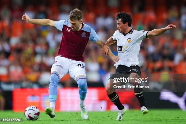 Calum Chambers of Aston Villa challenges for the ball against Gozalbez of Valencia CF during the Trofeu Taronja match between Valencia CF and Aston...