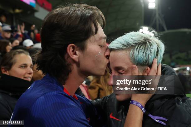 Megan Rapinoe of USA is seen crying with Austin Rapinoe as she reacts to her team being knocked out of the tournament after a penalty shoot out loss...
