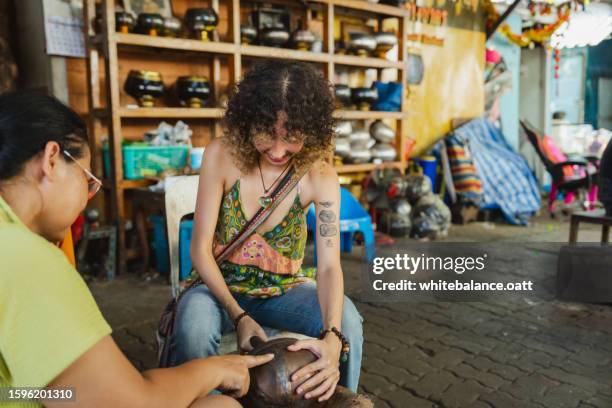 young asian woman enjoying experiential travel. - experiential vacations stock pictures, royalty-free photos & images